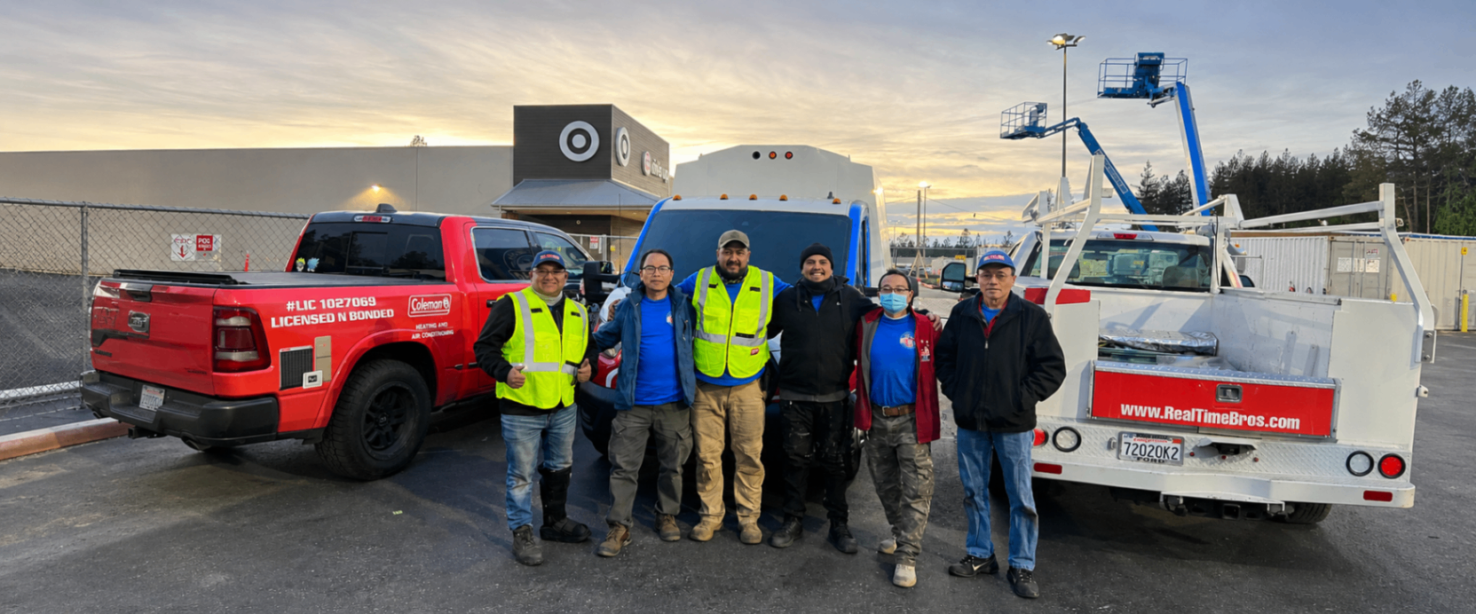 The Real Time Bros team together with their service vehicles